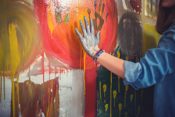 istock Female artist hand printing with paint 643329428