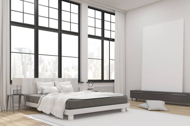 istock Corner of master bedroom interior with poster 643339530
