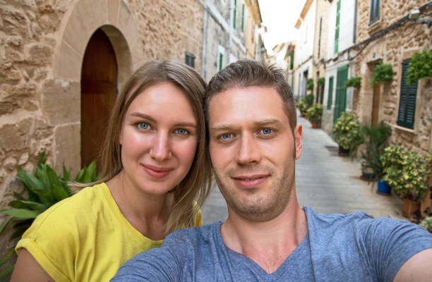 istock Lovely couple taking selfie in old town. 643346584