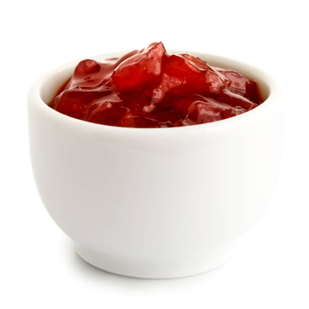 istock Red onion chutney in ceramic bowl isolated on white. 643349686