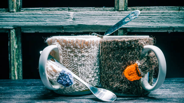 istock Couple of mugs in sweaters 643350196