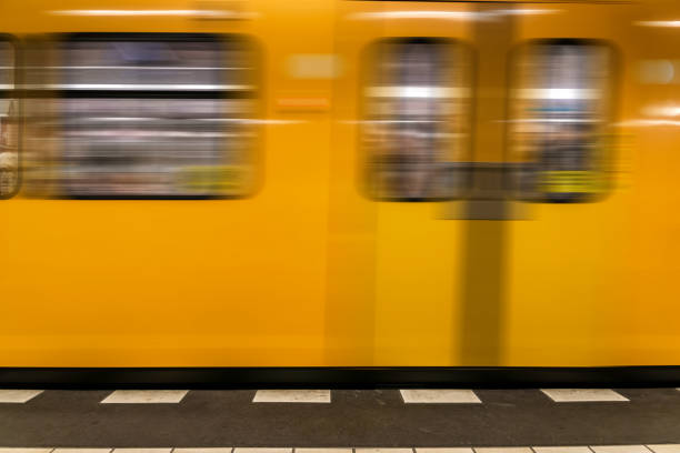istock Berlin metro underground - Yellow Train moving - nobody background 643350430