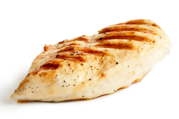 istock Whole grilled chicken breast with black pepper isolated on white. 643350554