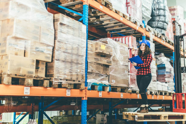 istock Woman working at a warehouse 643350874