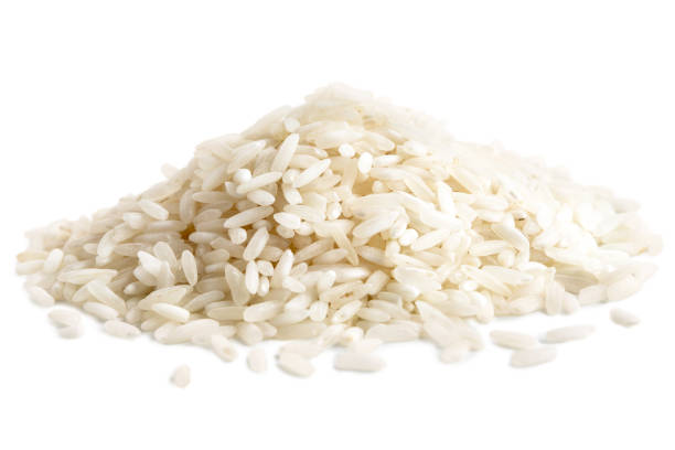 istock Pile of long grain white rice isolated on white. 643357670