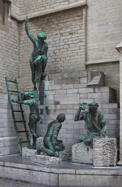 Antwerp, Belgium - July 22, 2014: Group sculpture dedicated to the cathedral of Our Lady builders Jan and Pieter Appelmans by Jef Lambeauxportal (1935) at the right side of cathedral