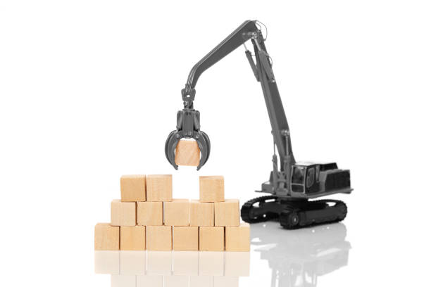 istock Crane and blank wooden cubes 643362270
