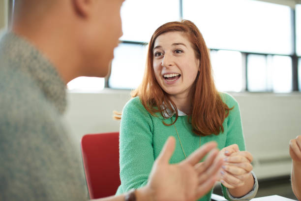 istock Unposed group of creative business entrepreneurs in an open concept office brainstorming together on a digital tablet 643364846