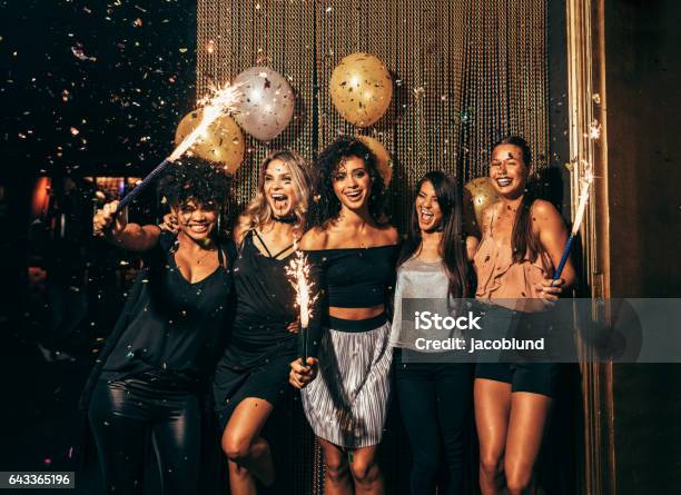 Group Of Friends Partying In Nightclub Stock Photo - Download Image Now - Party - Social Event, New Year's Eve, Women