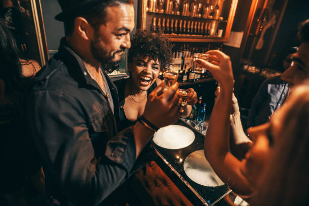 istock People having fun with drinks at nightclub 643365742