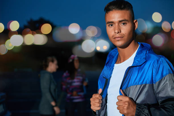 istock African american millennial guy looking straight at camera during a workout outdoors in a urban park late evening with friends 643368884