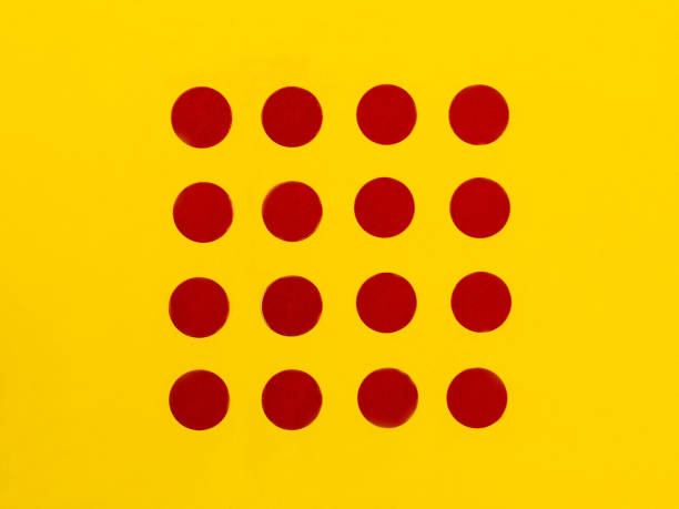 istock Red Spots on a Bright Yellow Background 643372476