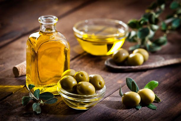 istock Olive oil and green olives 643383388