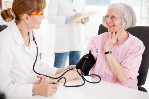 istock Senior woman visiting doctor. 643384056