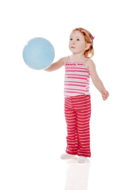 istock Girl Holding Balloon 643390668