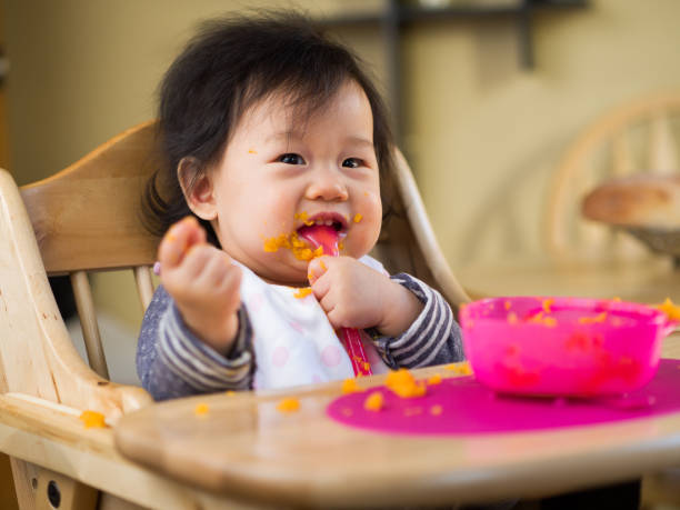 istock eating mess baby girl 643393344