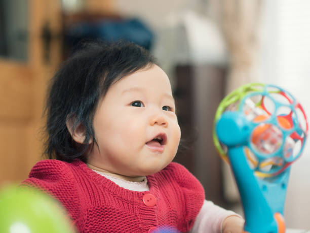 istock smiling Asian baby girl 643393414