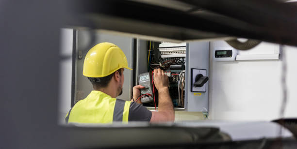Electrician Electrician testing for voltage in a fuse box maintenance engineer fuel and power generation power line electricity stock pictures, royalty-free photos & images