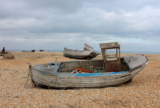 istock Boat graveyard and fishing huts at Dungeness, England 643416800