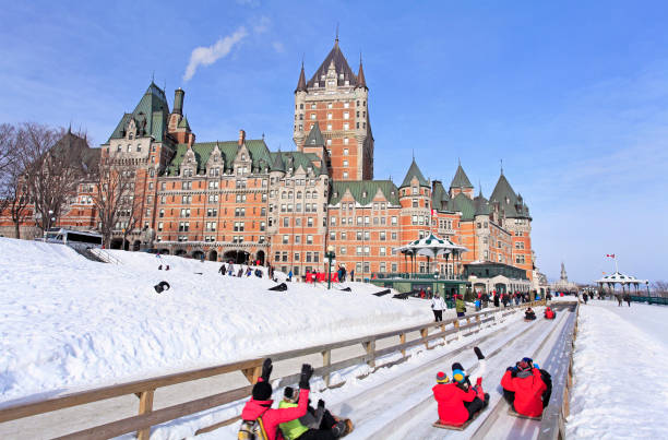 Chateau Frontenac in winter and traditional slide on the foreground, Quebec City stock photo