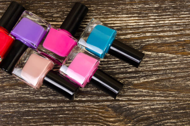 istock nail Polish laid out on wooden background 643424972