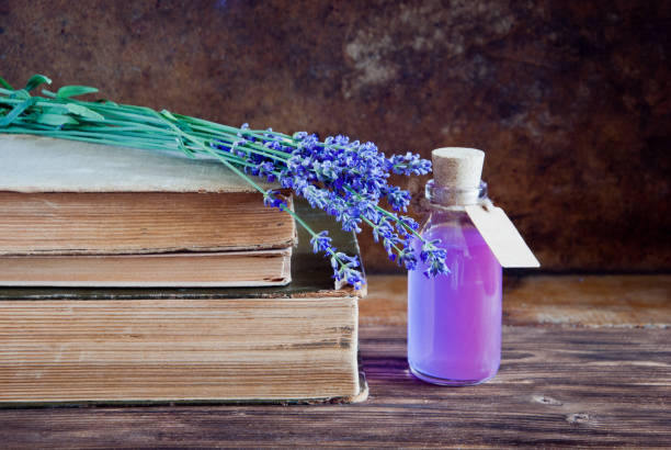 istock Lavender flowers, lavender essential and old books 643443164