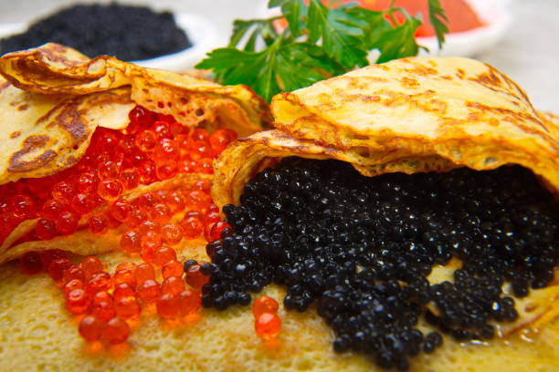 istock Pancakes with red and black caviar. 643446362