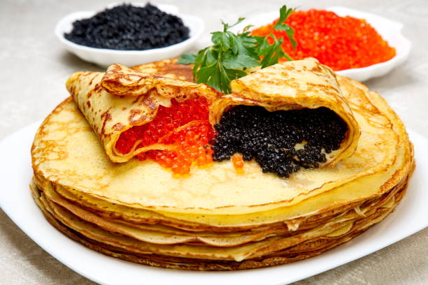 istock Pancakes with red and black caviar. 643446436