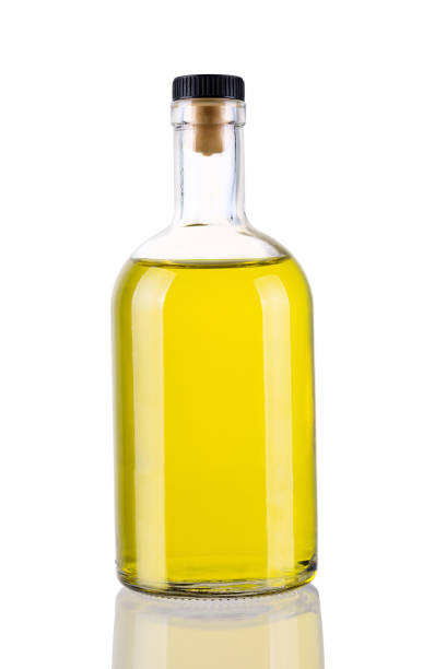 istock Glass bottle with yellow liquid isolated on white background 643449760