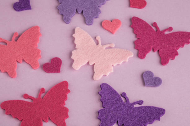 istock colorful butterflies on purple 643457194
