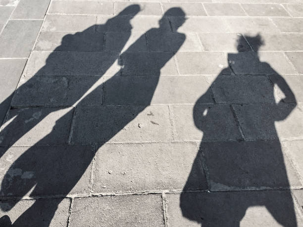 istock shadows of people 643457422