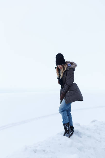 istock Girl on a background of a white field 643469942