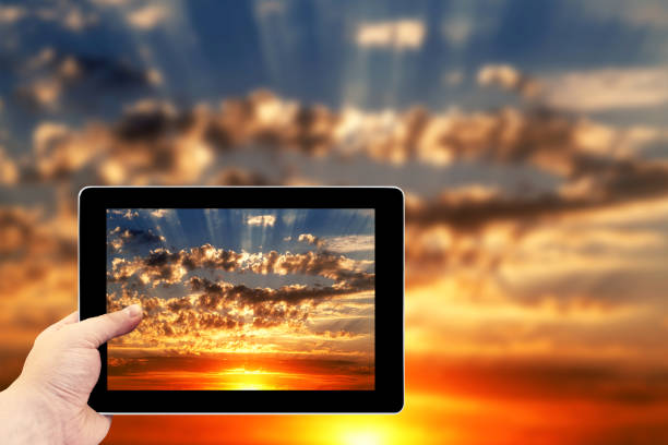 istock Tablet photography concept.Beautiful blue cloudy sky 643472618