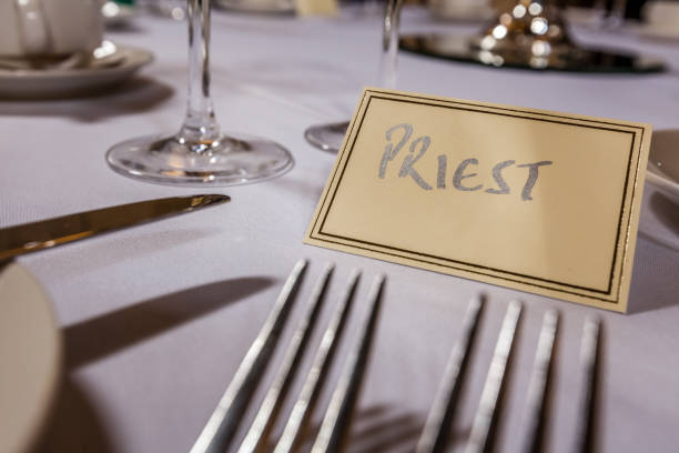 istock Priest seat at the wedding reception 643477388