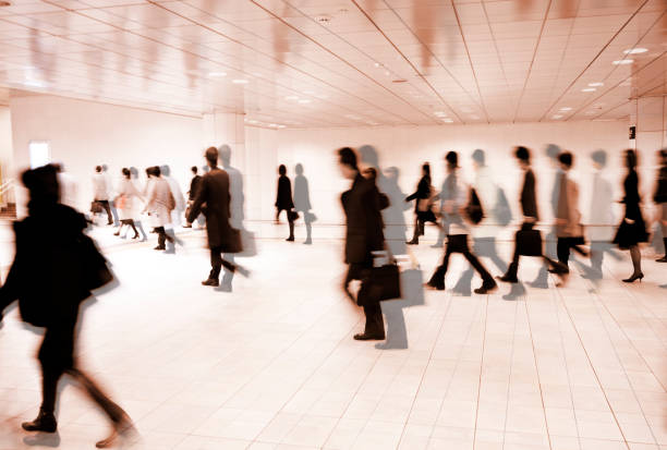 istock Crowds of People Walking Through Underground Pedestrian Walkway 643477508