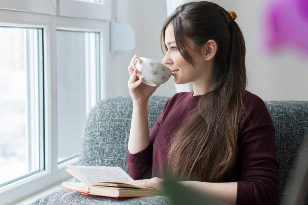 istock Young woman having a breakfast at home 643488078