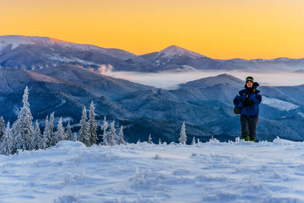 istock tourist in winter mountains 643492212