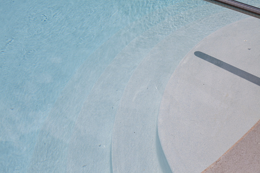 Steps leading into the shallow end of a clean pool