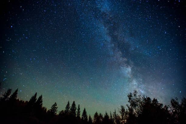istock fantastic winter meteor shower and the snow-capped mountains. 643499562