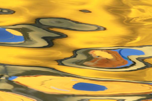 istock Blurred pools of reflected color on a lake 643500826