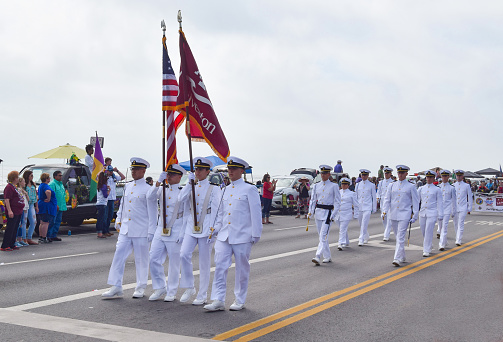 Galveston, USA - February 18, 2017:  A&M Galveston Cadets celebrate by marching in the Mardi Gras parade.
