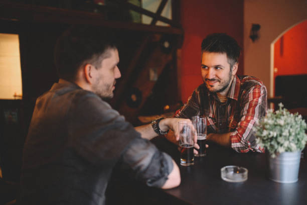 istock Young men sitting in the cafe 643509670