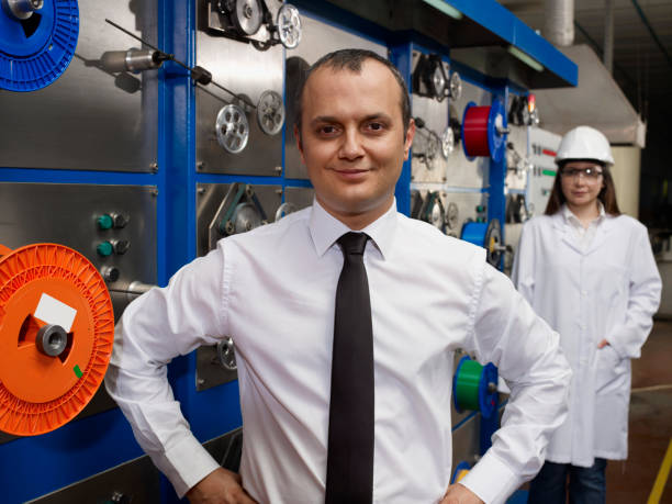 istock Blue collar workers in a factory 643515984
