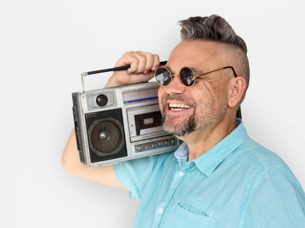 istock Caucasian Man Holding Jukebox Smile 643520924