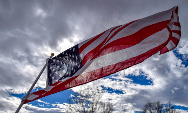 istock Flag flying on a February day 643522120