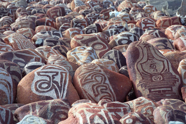 istock Pebbles from sacred Lake Manasarovar with Buddhist mantra. 643524998