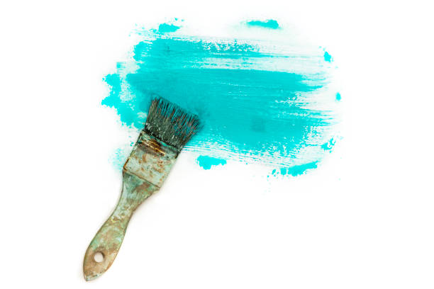 Clean paint brush on the yellow background with copy space. Painting