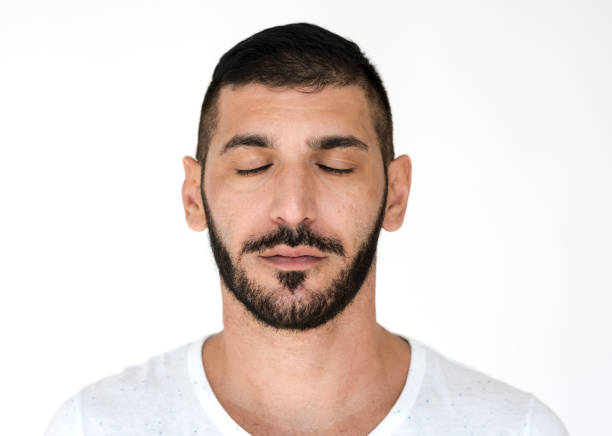 istock Middle Eastern Close Eyes Peaceful Calm Studio Portrait 643525744