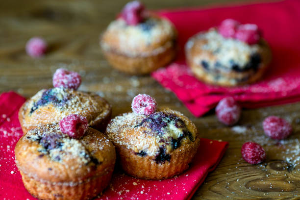istock Blueberry muffins on the napkin on wood background 643530702
