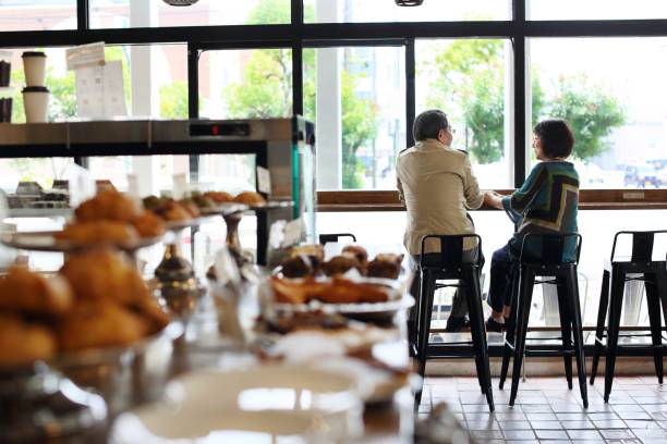 istock An old couple talking happily in a cafe 643531542